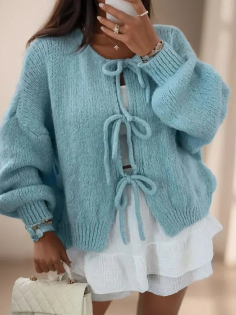 Women's chunky knit cardigan in cozy winter style with knotted front tie detail for flattering fit