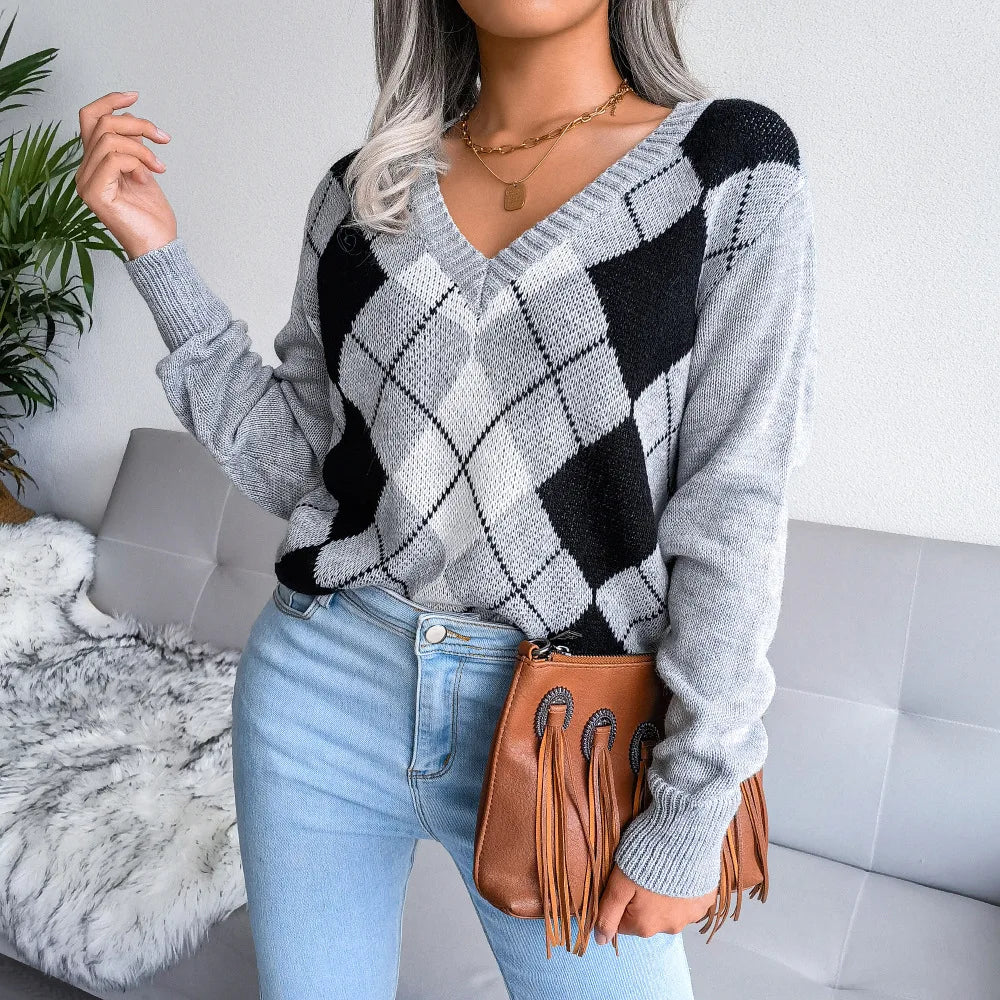 Soft blue argyle knit pullover with relaxed unisex silhouette and classic diamond collegiate motif