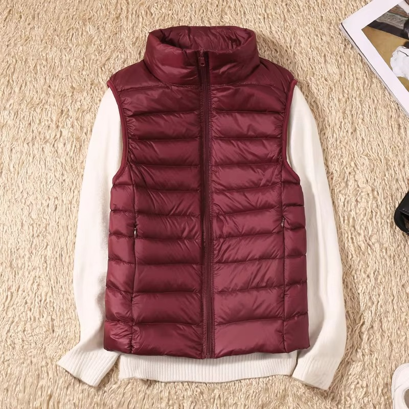 Women's cropped sleeveless light down puffer vest in neutral tone, slim quilted fit