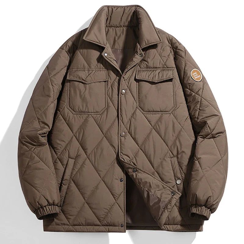 Black quilted puffer winter jacket with stand-up collar, ribbed cuffs, and snap button closure