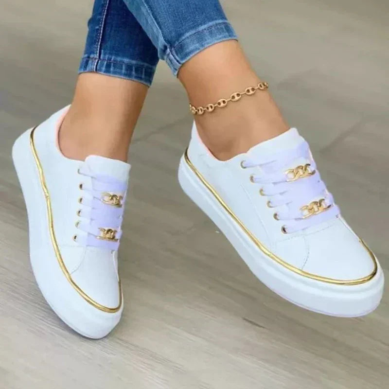 Women's white faux leather low-top platform sneakers with ankle chain detail and comfort sole