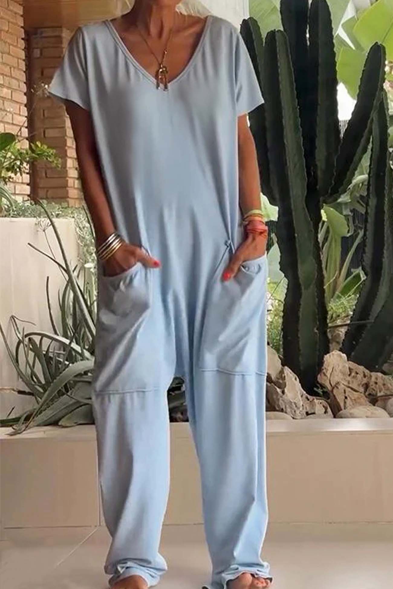 Women's loose V-neck short sleeve jumpsuit with drop-crotch silhouette and oversized front pockets