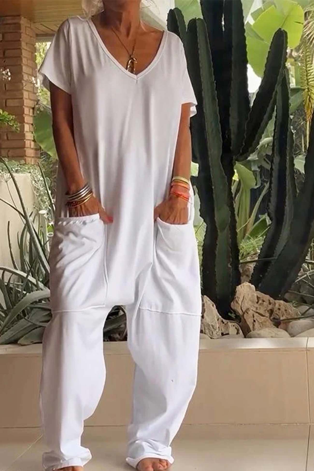 Women's loose V-neck short sleeve jumpsuit with drop-crotch silhouette and oversized front pockets