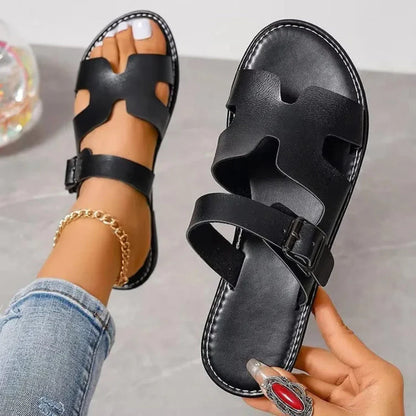 Sienna women's faux leather flat sandals in tan with cut-out design and adjustable buckle strap