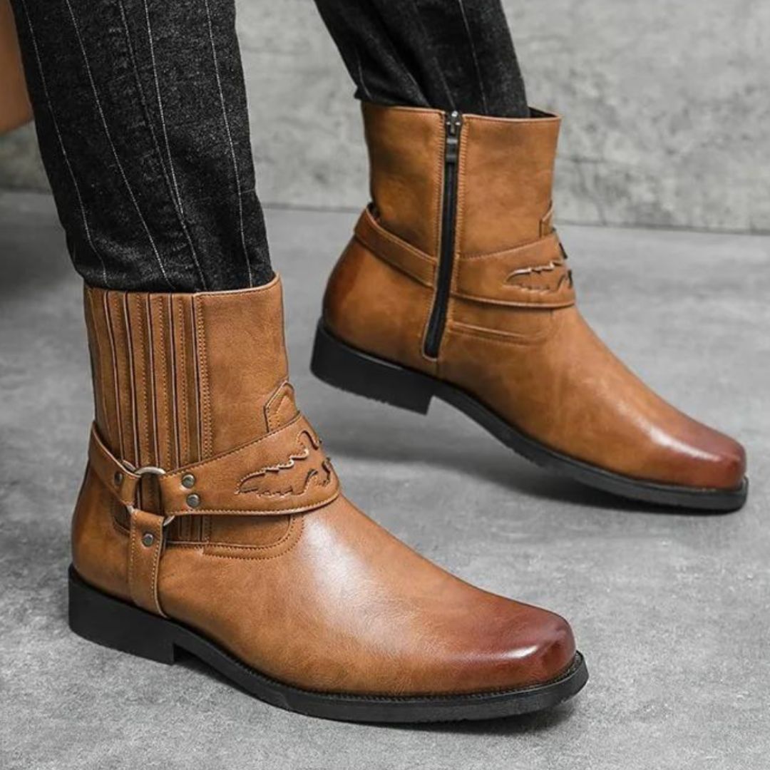 Brown faux leather Western boots with strap detail, inner side zipper, and rubber outsole