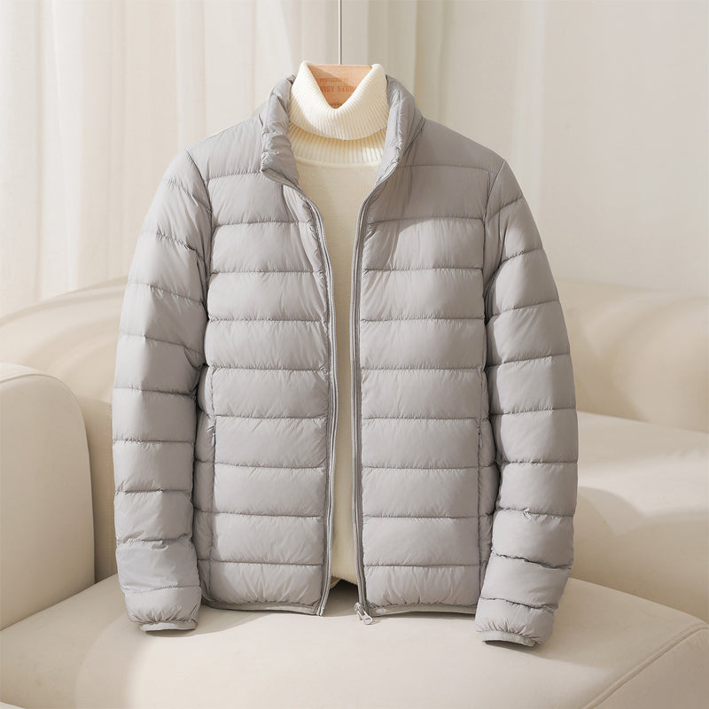 Silva pastel down jacket with high collar, lightweight insulation, elasticized cuffs, and fitted hem