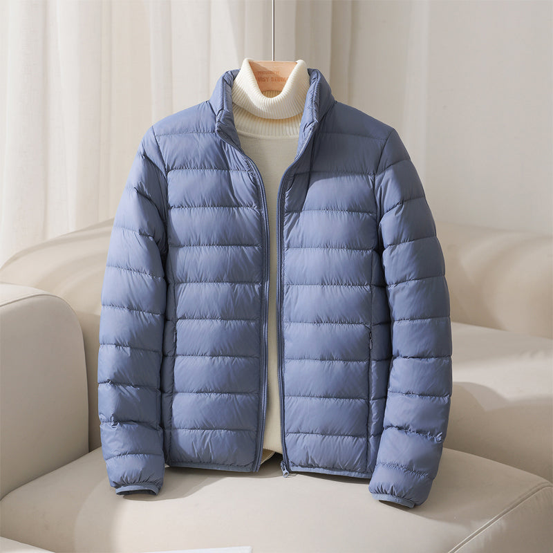 Silva pastel down jacket with high collar, lightweight insulation, elasticized cuffs, and fitted hem