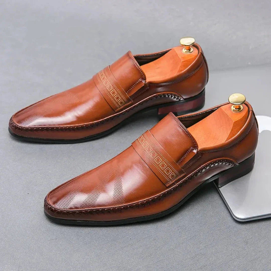 Silvano slip-on leather dress shoes in classic black with polished finish and loafer silhouette