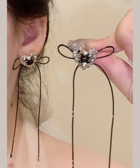 Boucles d'oreilles pendantes simples en cuivre noir avec nœud d'amour et pompon - Wavlynn
