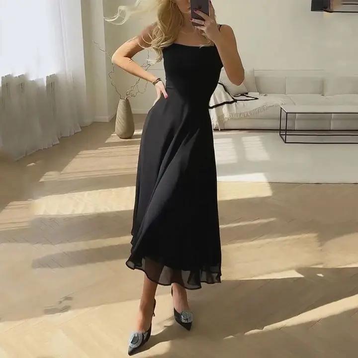 Women's sleeveless midi dress in solid color, chic relaxed fit with soft-touch lightweight fabric