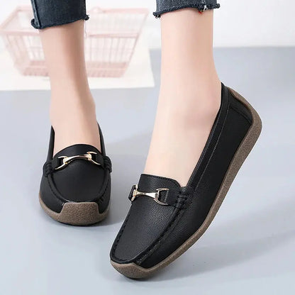 Women's slip-on moccasin flats in neutral faux leather with clean stitching and rounded toe
