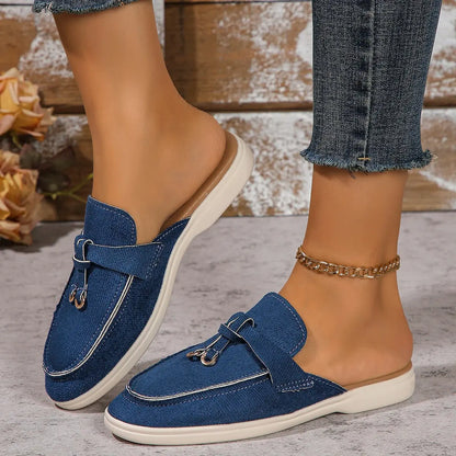 Women's white slip-on casual sneakers with lightweight rubber sole and textured synthetic upper