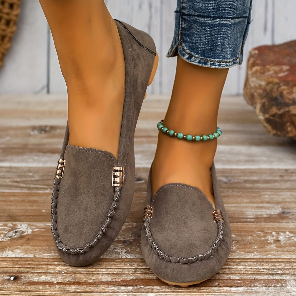 Women's slip-on moccasin loafers in neutral PU leather with classic stitching and cushioned flat sole