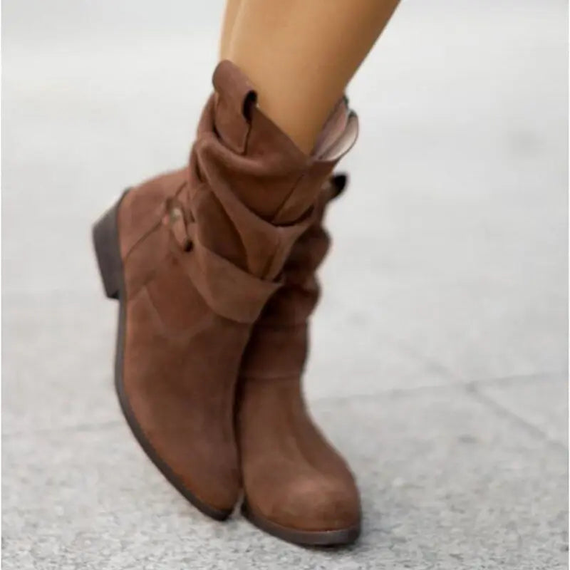 Women's black slouched ankle boots with chic low heel and relaxed contemporary silhouette