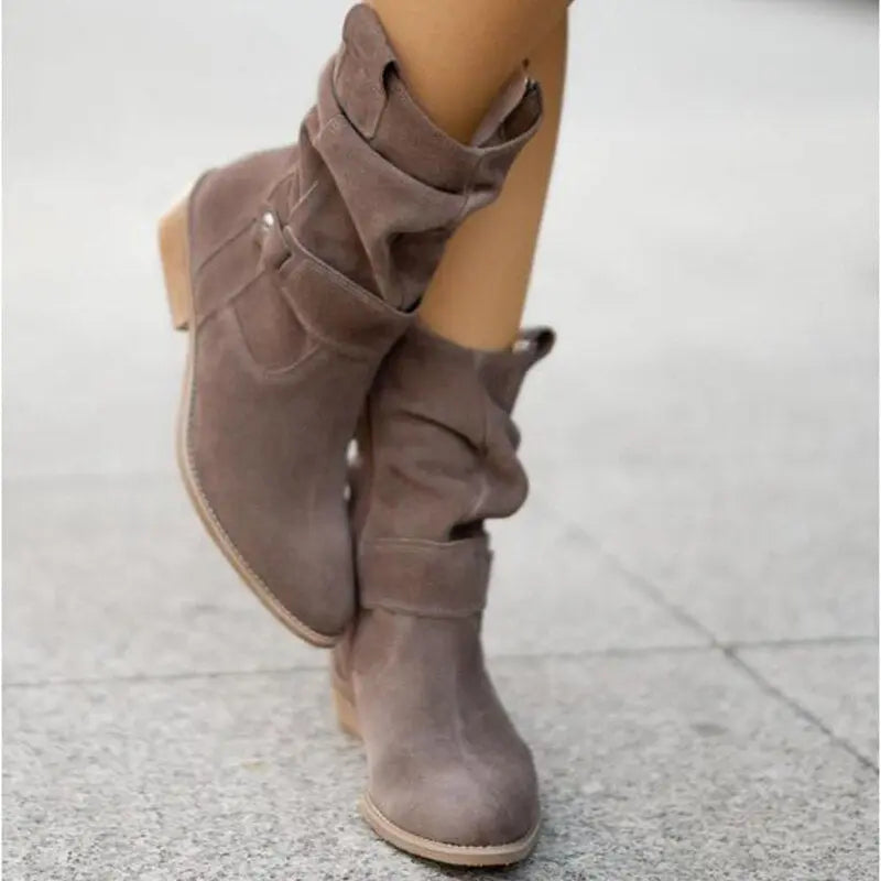 Women's black slouched ankle boots with chic low heel and relaxed contemporary silhouette