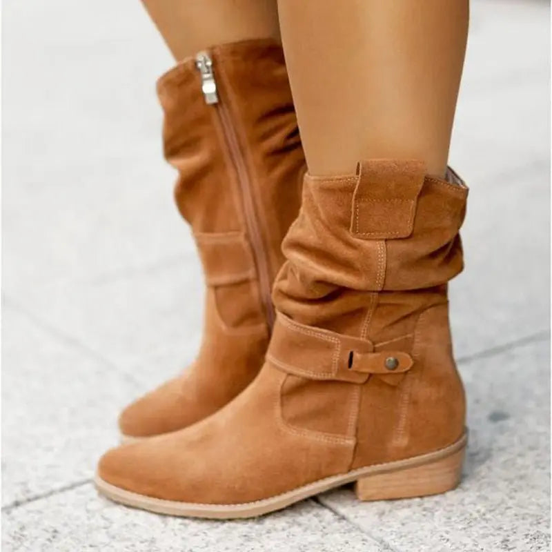 Women's black slouched ankle boots with low heel and relaxed chic silhouette for versatile styling