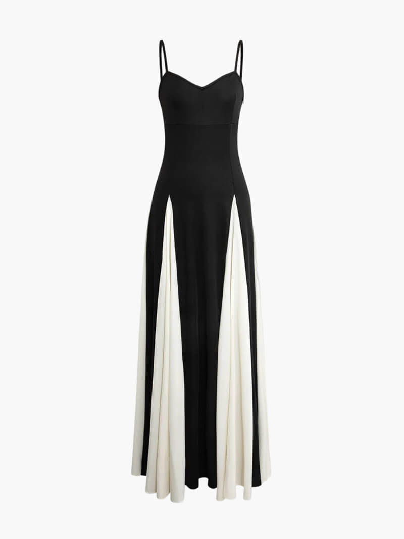 Elegant black-and-white maxi dress with flowing silhouette and open-back detail