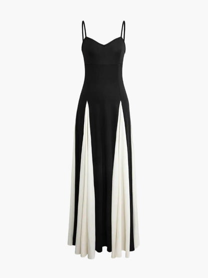 Elegant black-and-white maxi dress with flowing silhouette and open-back detail
