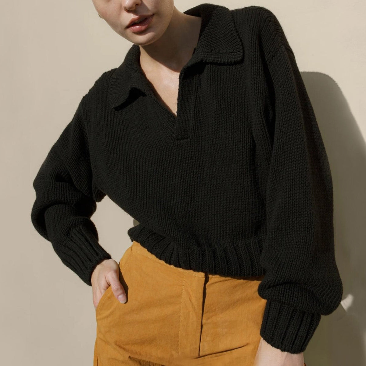 Ivory loose-fit knit sweater with bold lapel collar and irregular design, cotton-spandex blend