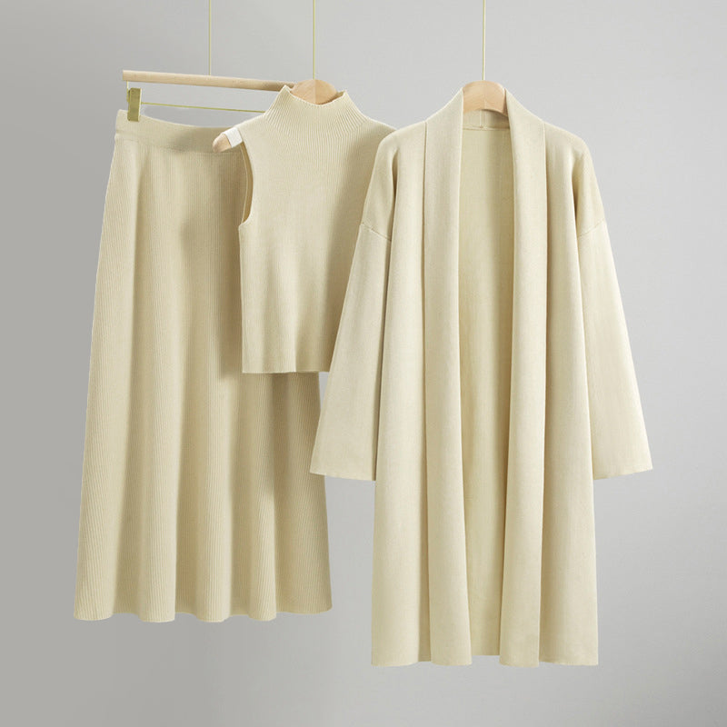 Amber knit 3-piece set with open cardigan, sleeveless top, and flared midi skirt for quiet luxury