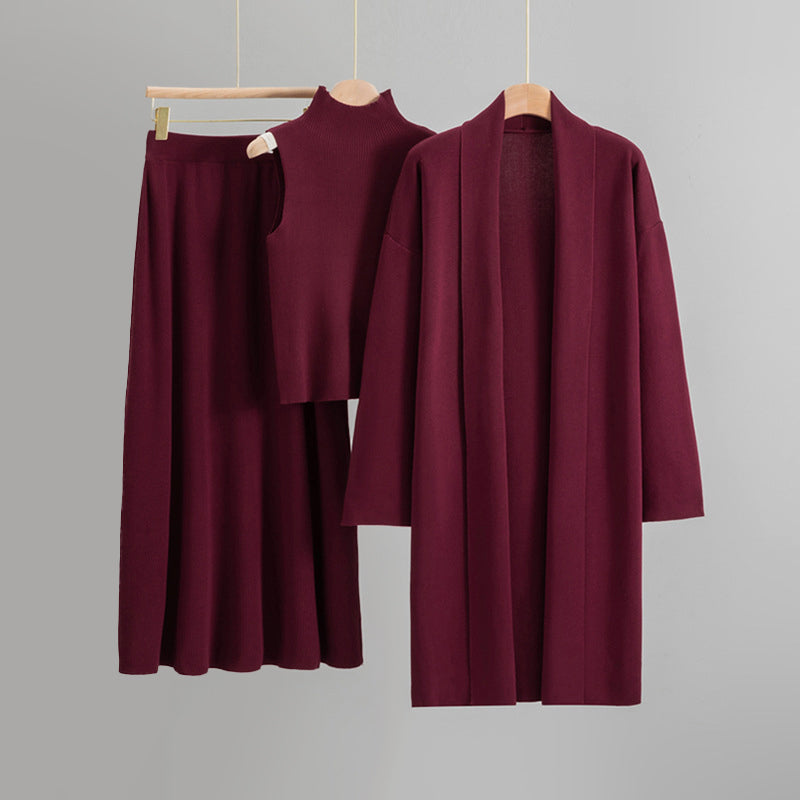 Amber knit 3-piece set with open cardigan, sleeveless top, and flared midi skirt for quiet luxury layering