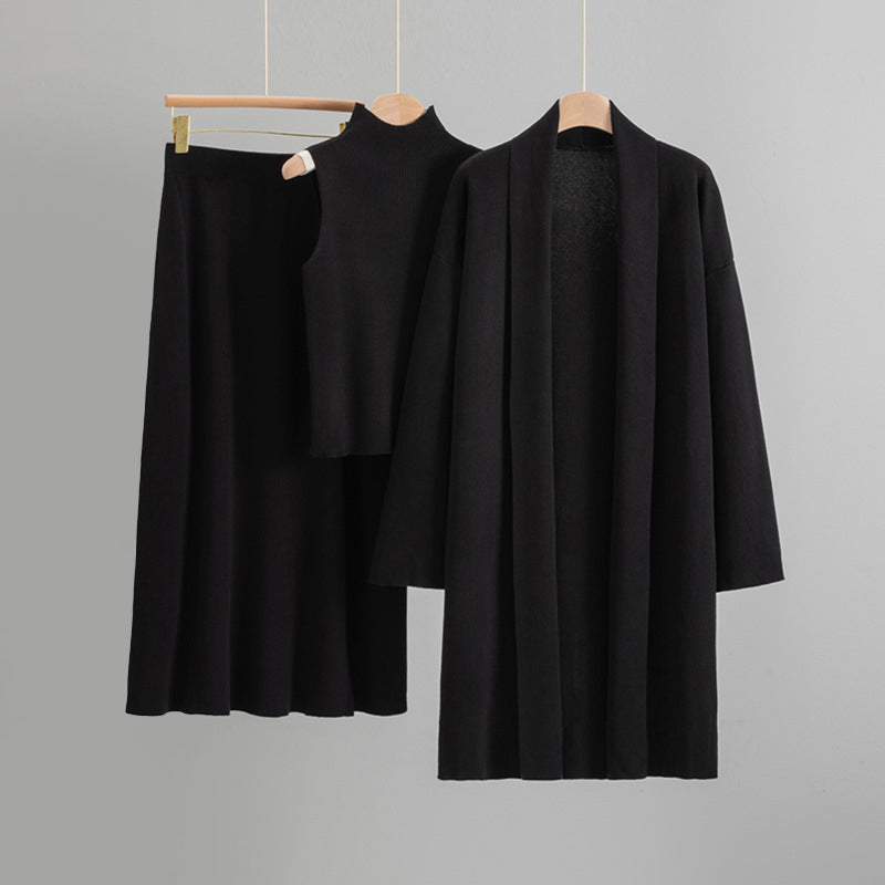 Amber knit 3-piece set with open cardigan, sleeveless top, and flared midi skirt for quiet luxury layering