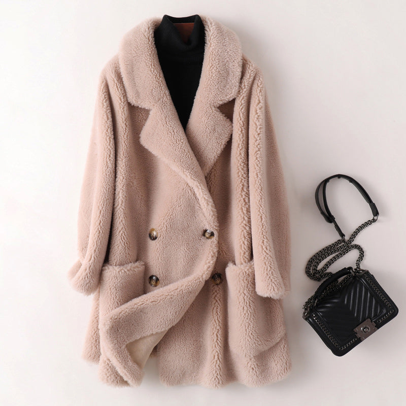 Women's bright pink faux fur shearling oversized coat with plush cocooning texture