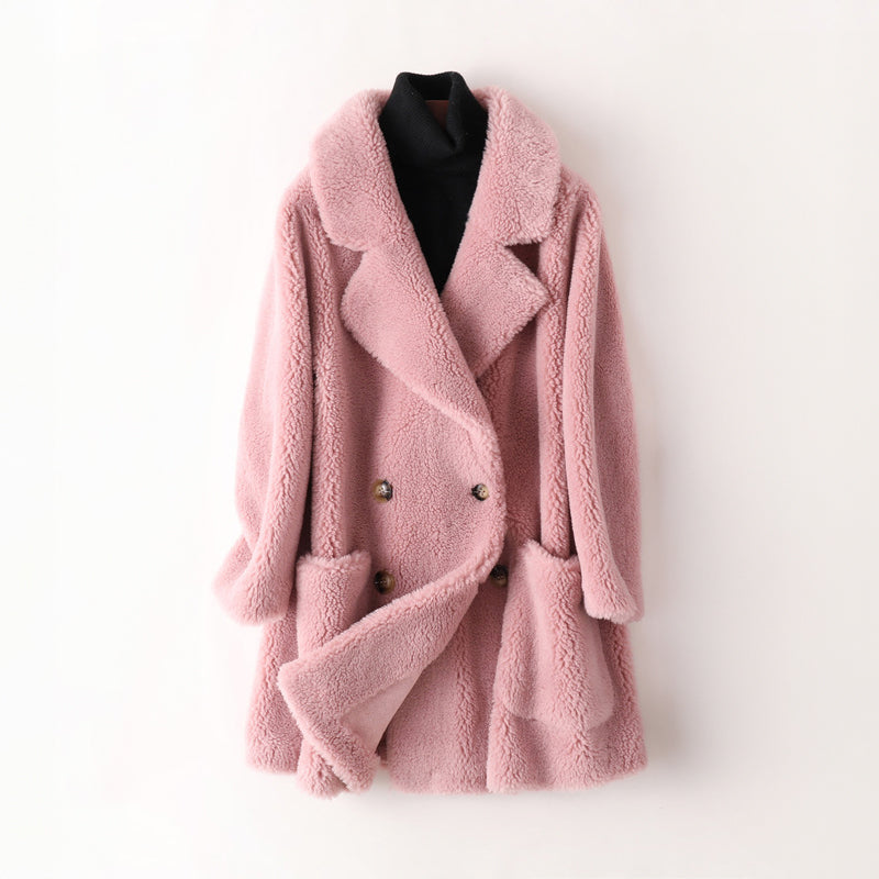 Women's pink faux fur shearling oversized coat with plush cocooning silhouette for winter