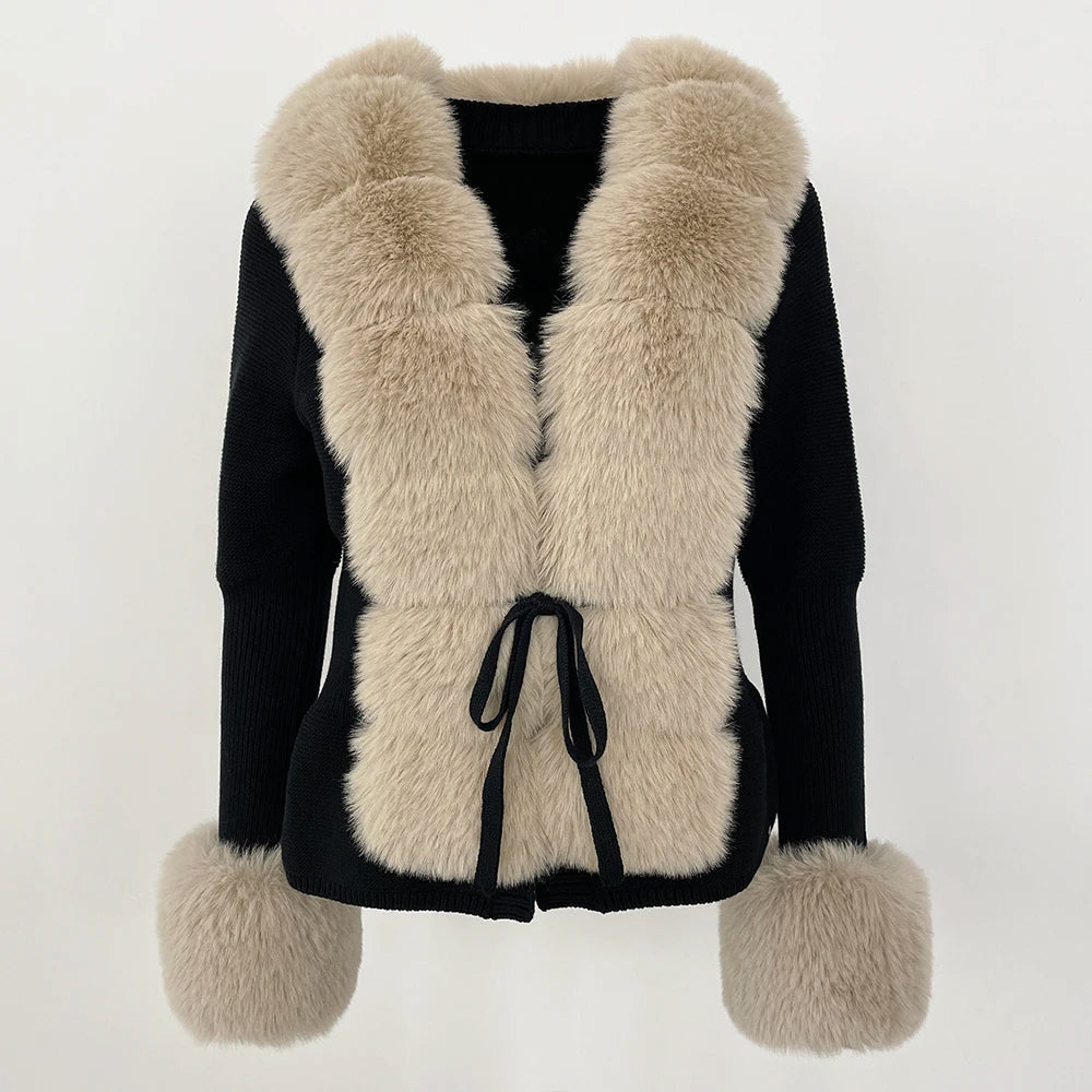 White fur cardigan with geometric block pattern, oversized cuffs, and structured cold-weather style