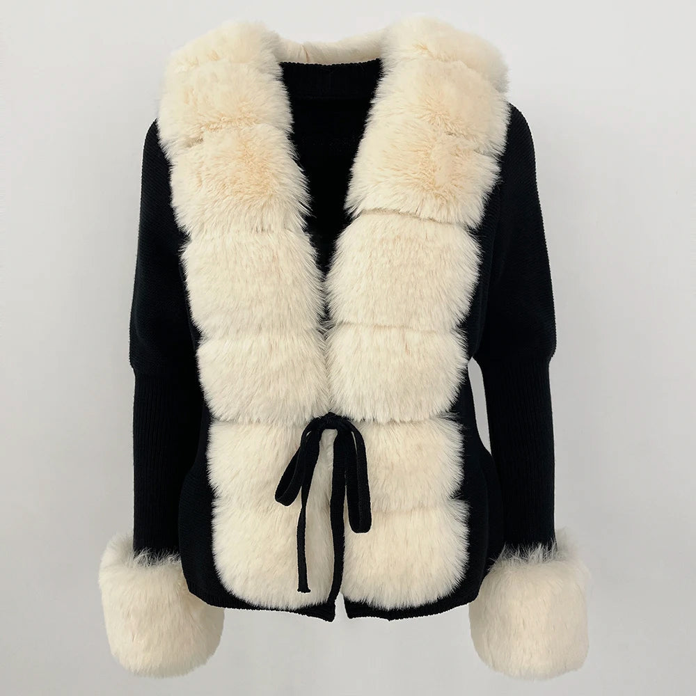 White fur cardigan with geometric block texture, oversized cuffs, bold structured cold-weather style