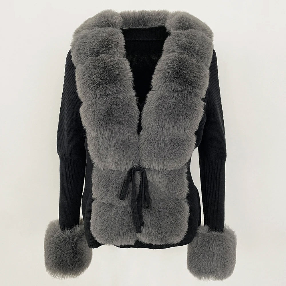 White fur cardigan with geometric block pattern, oversized cuffs, and plush pillow-soft texture