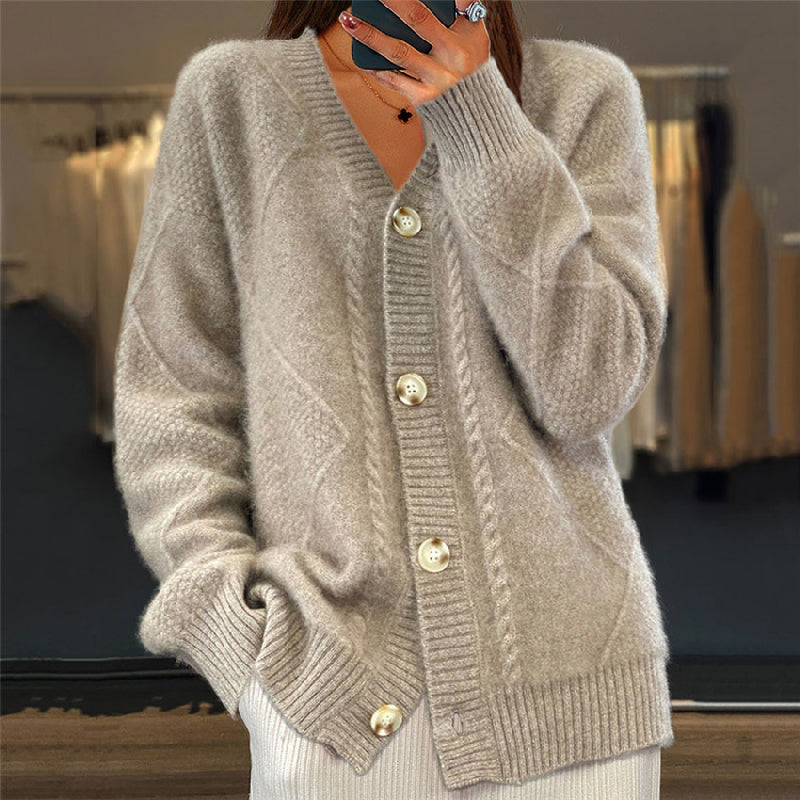 Pink cable knit cardigan relaxed V-neckline opalescent buttons ribbed cuffs premium wool