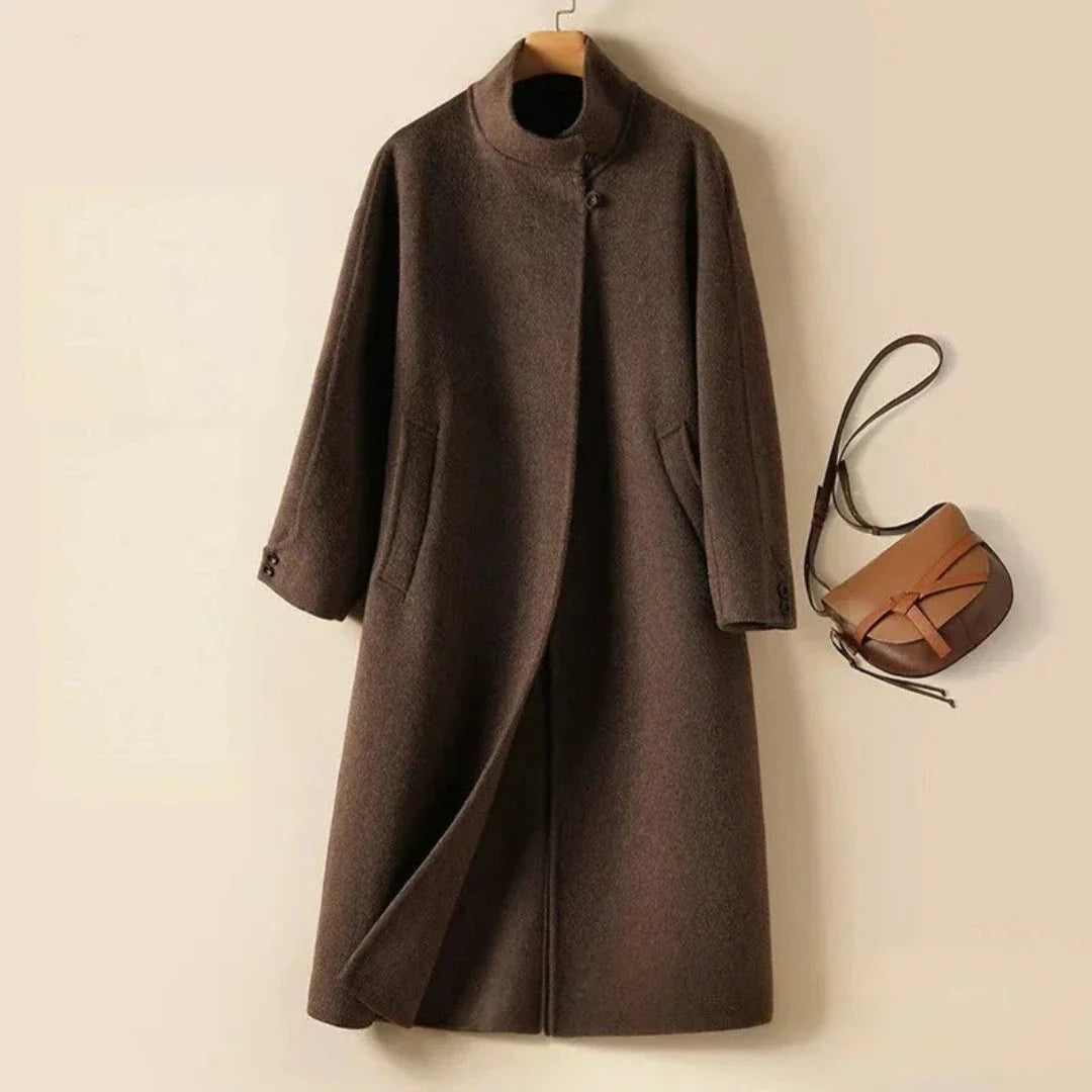 Camel longline wool coat collarless neckline hidden closure tailored silhouette