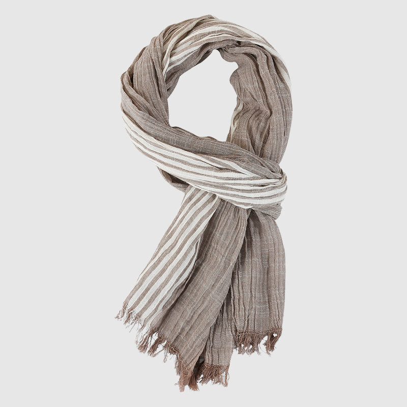 Lightweight striped viscose blend scarf with soft fringed hem, perfect for layering over shoulders