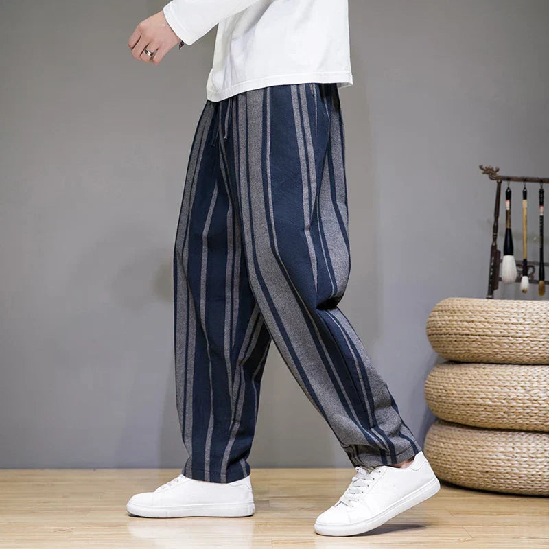 Striped lounge pants with elastic drawstring waistband, relaxed fit, vertical contrast stripes
