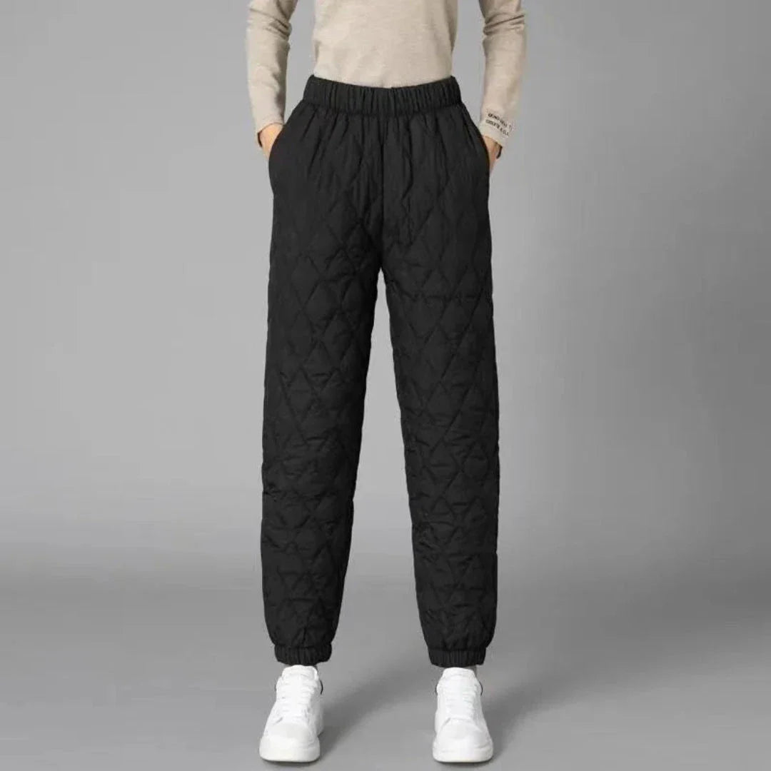 Women's black quilted thermal jogger pants with diamond-stitched exterior for winter warmth