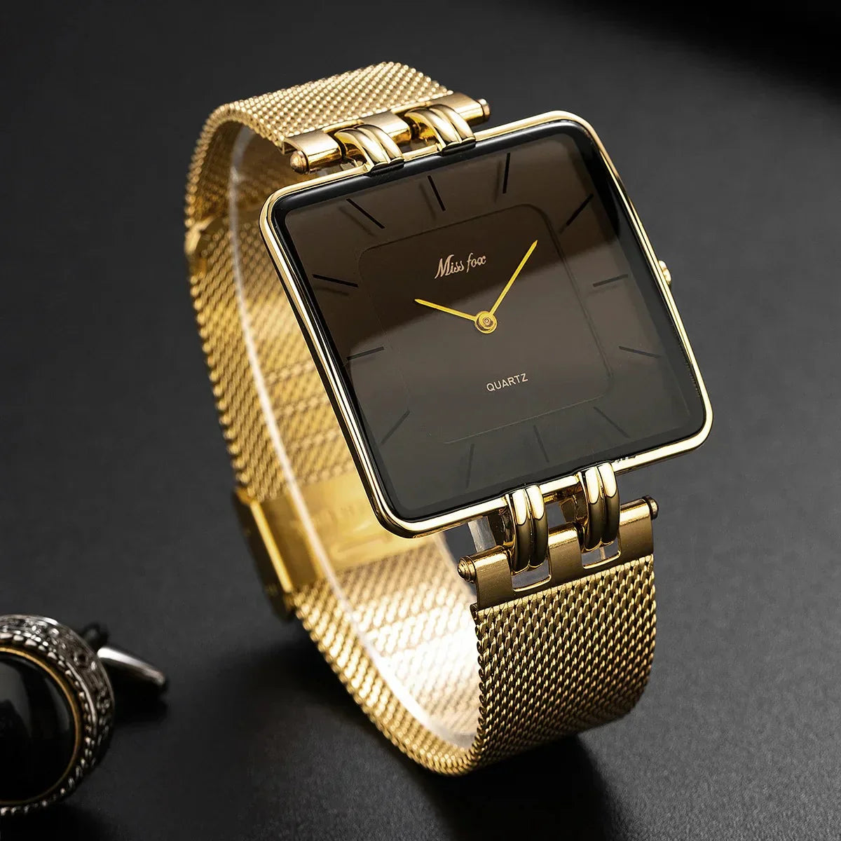 Statement bold gold mesh watch with geometric dial, Swiss precision, minimalist design, gleaming metalwork