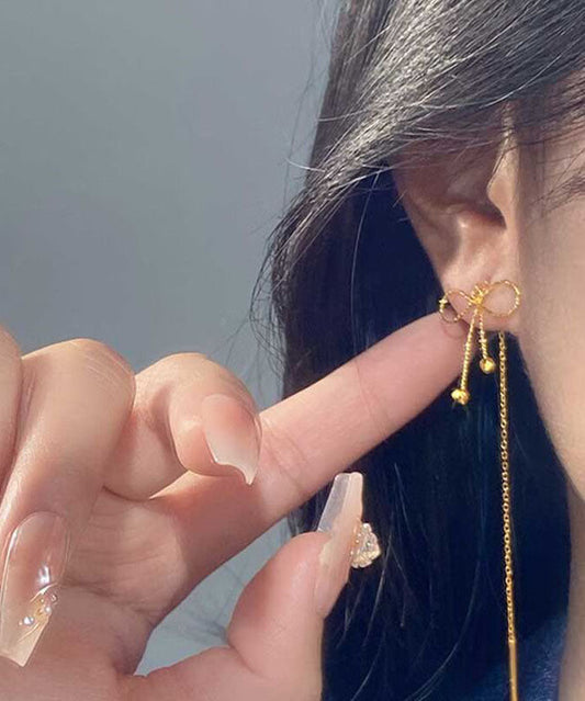 Boucles d'oreilles pendantes élégantes en argent sterling doré avec nœud - Wavlynn