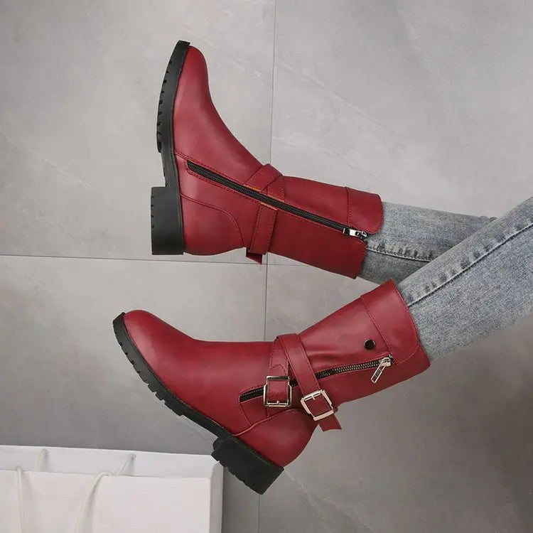 Women's black synthetic leather low-heel ankle boots with sleek city-ready silhouette and versatile everyday style