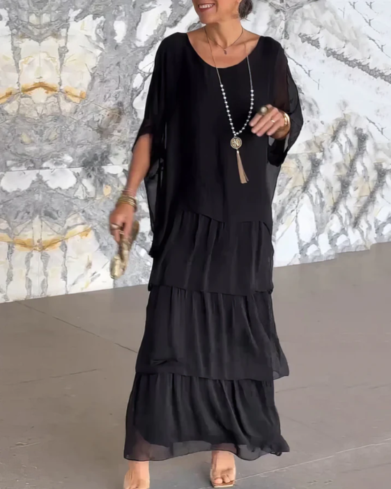 Elegant long flowing dress in soft hues, flattering silhouette with graceful drape for formal occasions