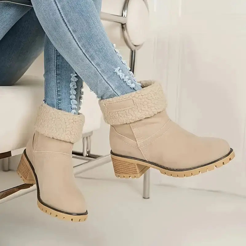 Women's suede ankle boots in warm neutral tone, elegant winter style with plush-lined comfort