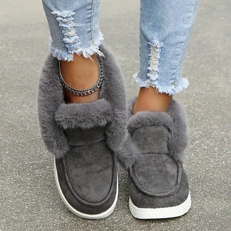 Women's cozy suede winter boots with plush fur lining, elegant silhouette, and non-slip sole