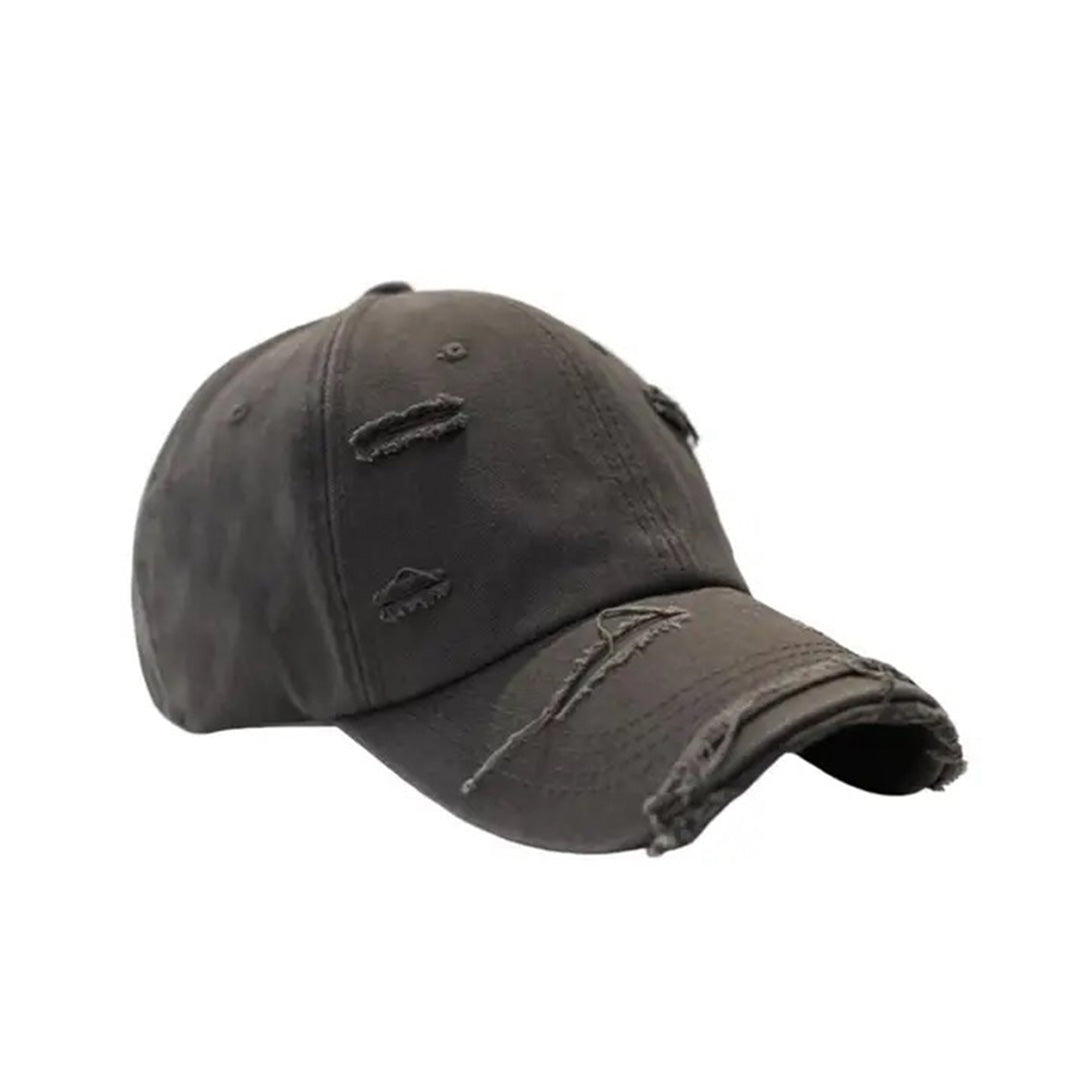 Vintage distressed baseball hat in cotton with extended brim and rugged ripped detailing