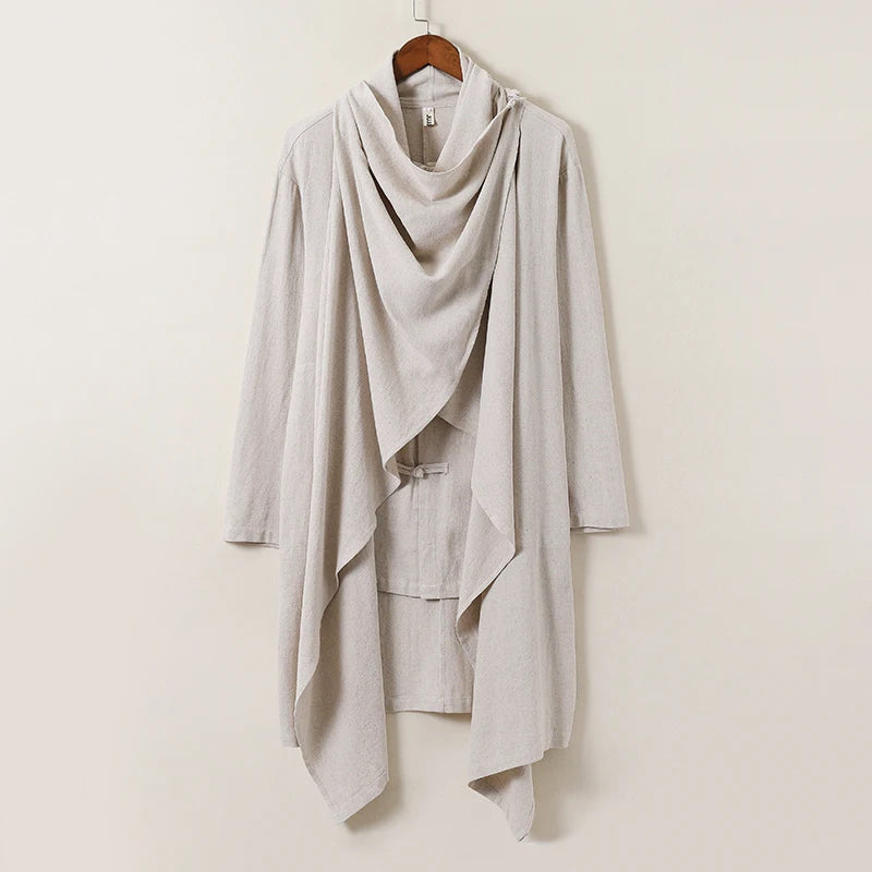 Ivory linen cape with flowing silhouette and traditional Japanese knot buttons