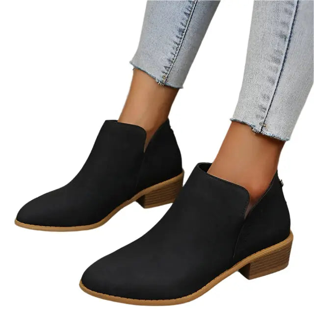 Women's tapered silhouette low heel boots in neutral tone, sleek streamlined profile for all-day wear