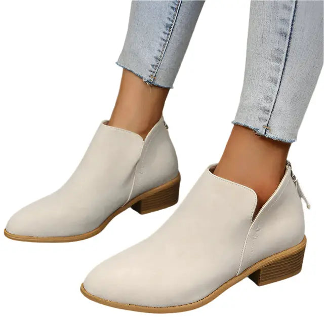 Women's black tapered silhouette low heel boots with sleek streamlined profile for all-day wear