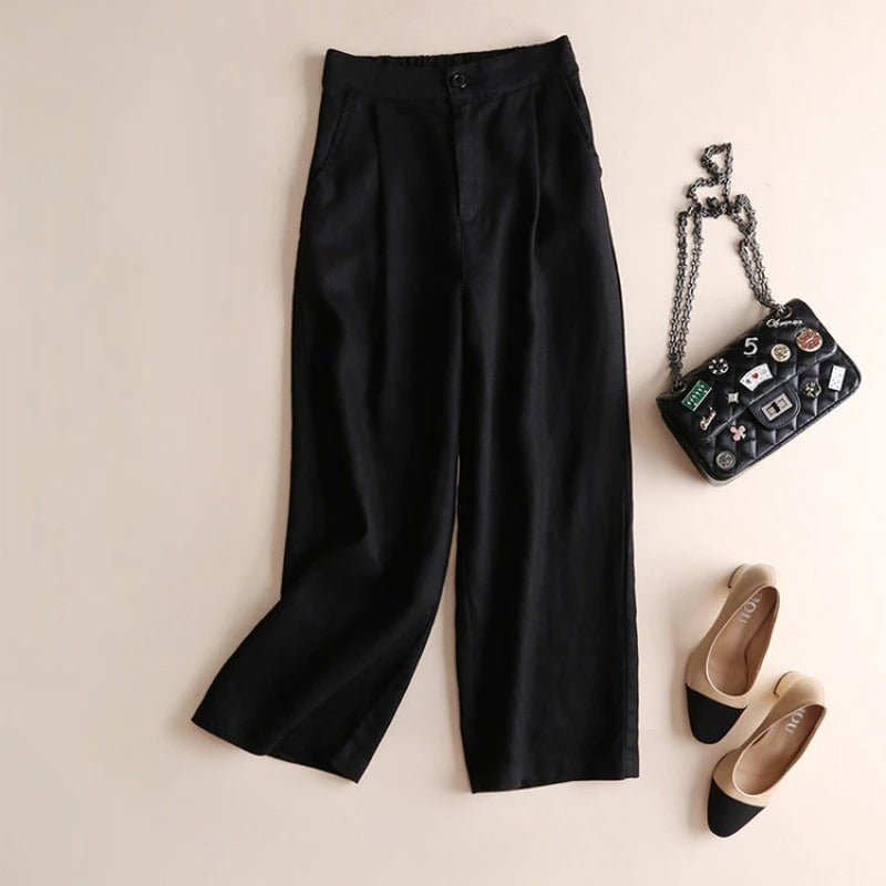 Ivory relaxed tapered linen pants with button-closure waist and soft Tencel blend drape