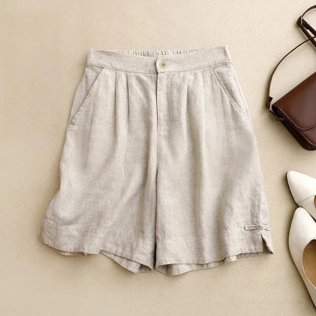 Tessa high-waisted tailored linen shorts in neutral tone with relaxed fit and structured silhouette