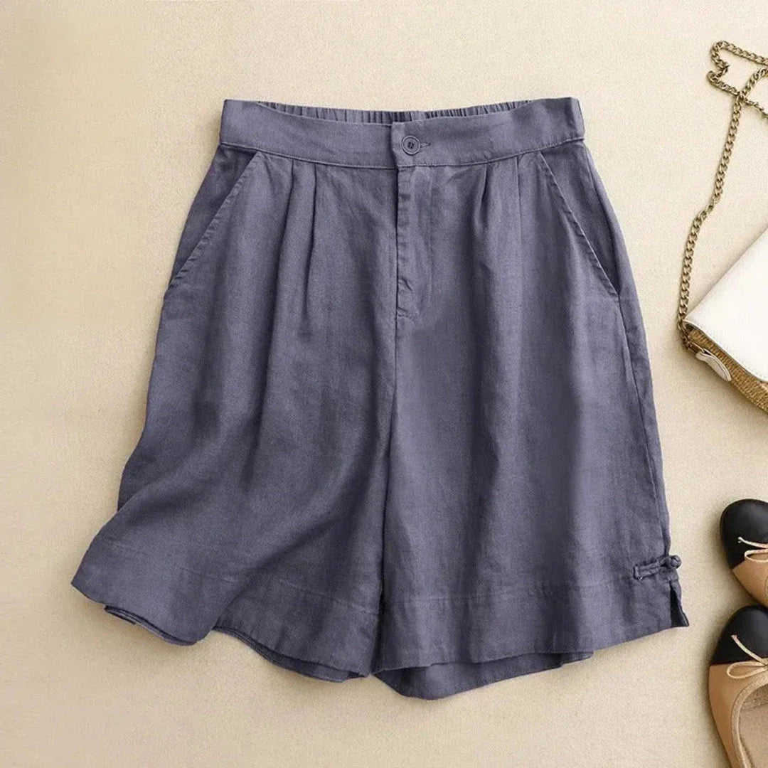 Tessa high-waisted tailored linen shorts in neutral tone with relaxed fit and structured silhouette
