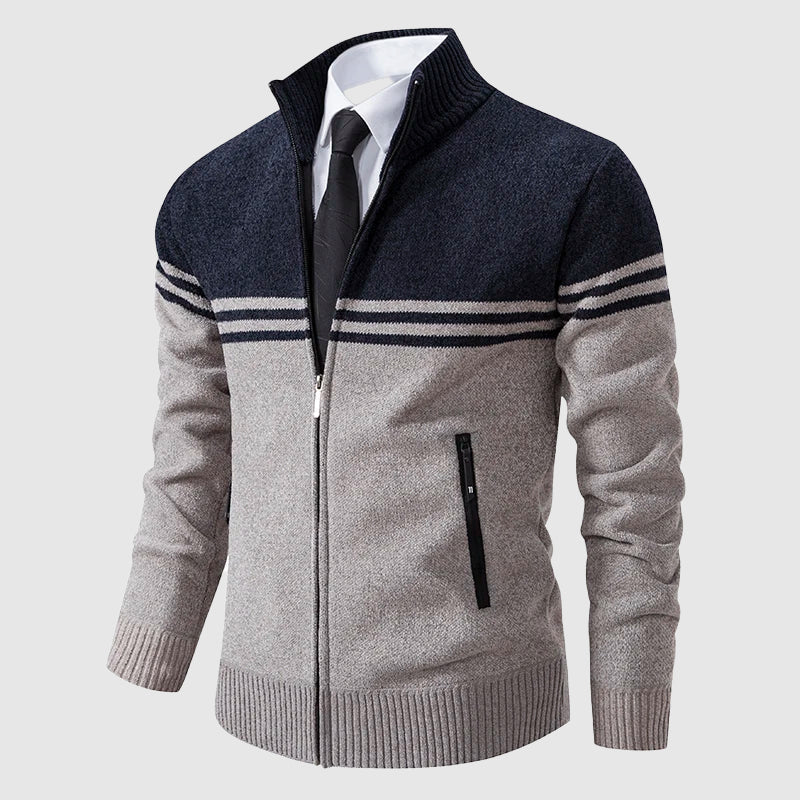 Navy and beige two-tone zip-up cardigan with striped detail, high collar, and ribbed cuffs